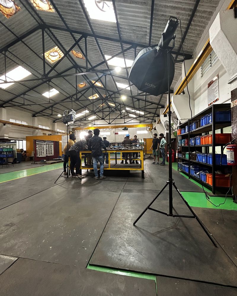 Lights set up for a shoot on a factory floor